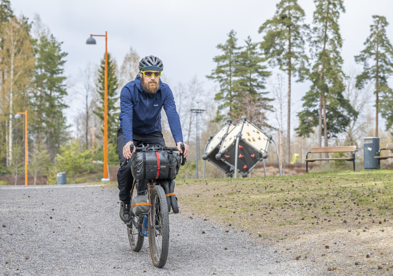 Taneli Roininen cycling in a park